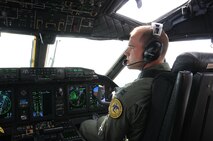 Capt. Garrett Caponetti pilots the C-27J Spartan during a familiarization flight over New England Friday, Oct. 22, 2010.  Capt. Caponetti is currently assigned to the 118th Airlift Squadron, Bradley Air National Guard Base in East Granby, Conn. and was among the first of the Flying Yankees to fly the new light cargo aircraft that visited the base to give members there a glimpse of their future mission.