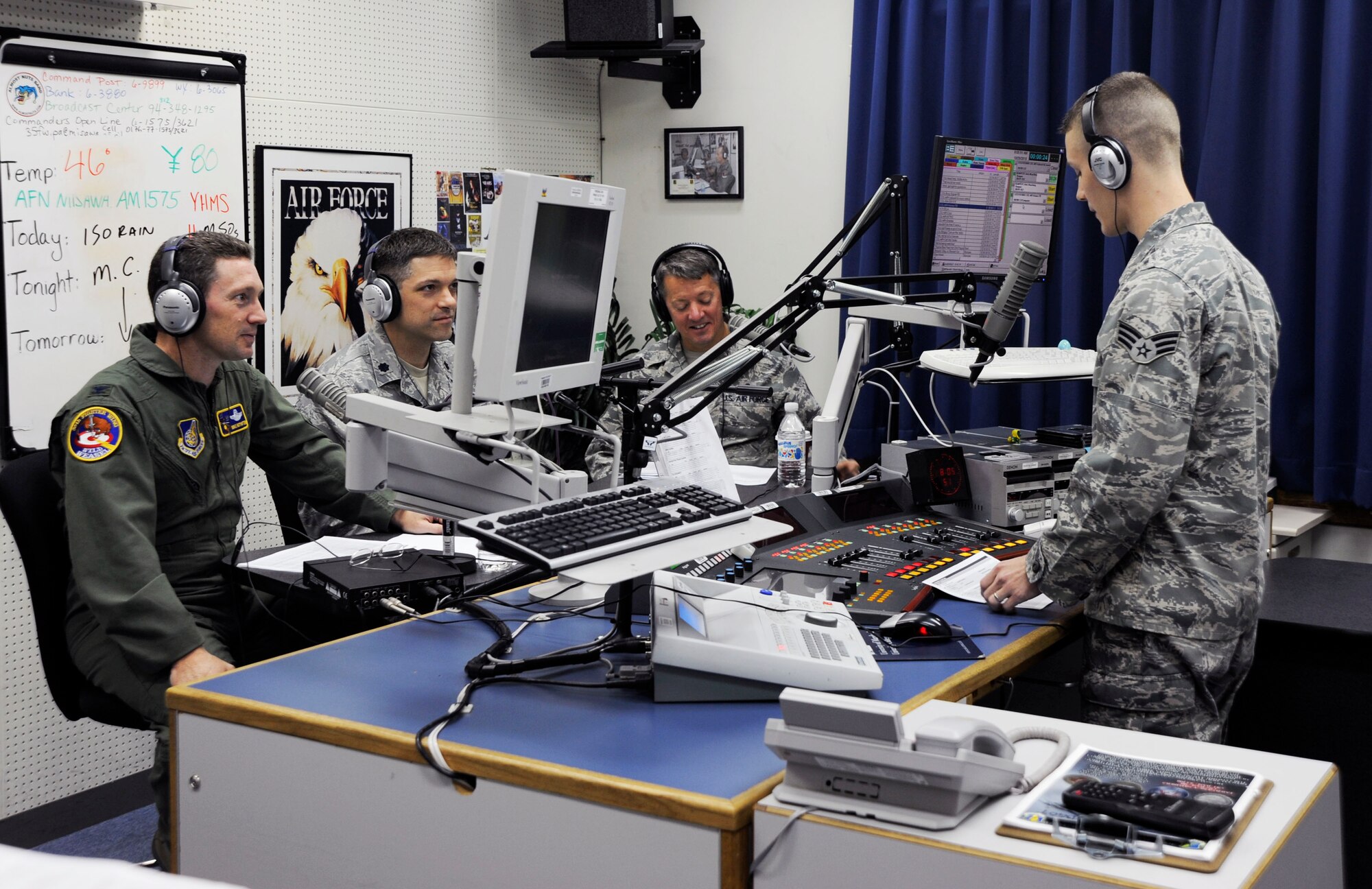 U.S. Air Force Senior Airman Chance Smith,right, American Forces Network Misawa, broadcast Commander's Open Line radio show at Misawa Air Base, Japan, Oct. 29, 2010. Once a month, wing leadership answers questions and informs the base community on current hot topics and issues. (U.S. Air Force photo by Tech. Sgt. Russell McBride/ Released)