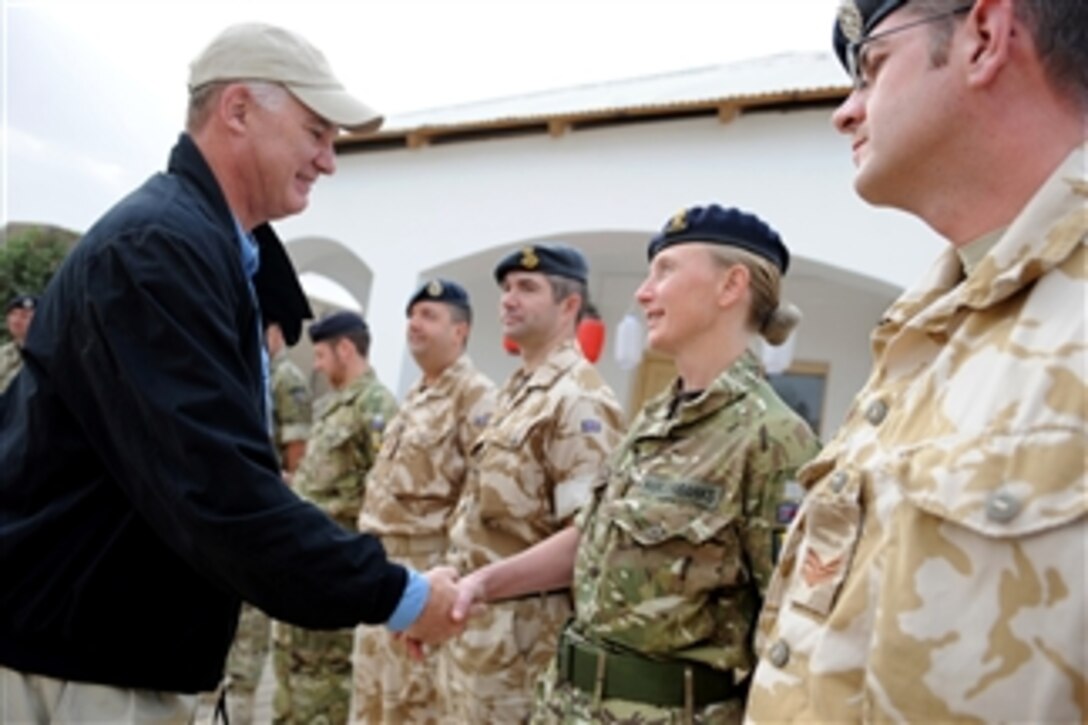 Deputy Secretary of Defense William J. Lynn III shakes hands with British soldiers while visiting the Provincial Reconstruction Team in Lashkar Gah, Afghanistan, on Oct. 28, 2010.  