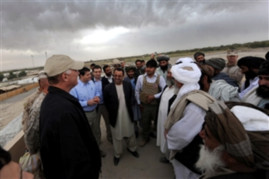 Afghan Governor Ghulab Mangal (3rd from left) and local Afghans speak with Deputy Secretary of Defense William J. Lynn III during a tour of Nawa, Afghanistan, on Oct. 28, 2010.  