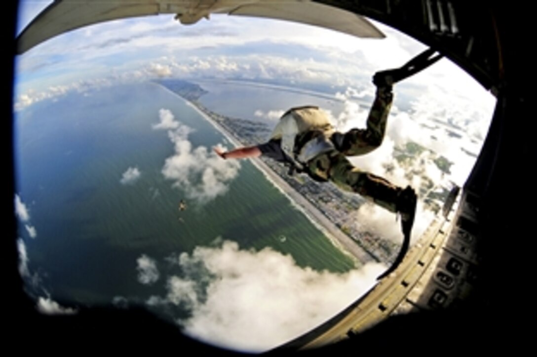 A pararescueman jumps from an HC-130P/N King aircraft while performing a freefall rescue demonstration at Cocoa Beach, Fla., Oct. 27, 2010. The pararescueman is assigned to the 920th Rescue Wing on Patrick Air Force Base, Fla.