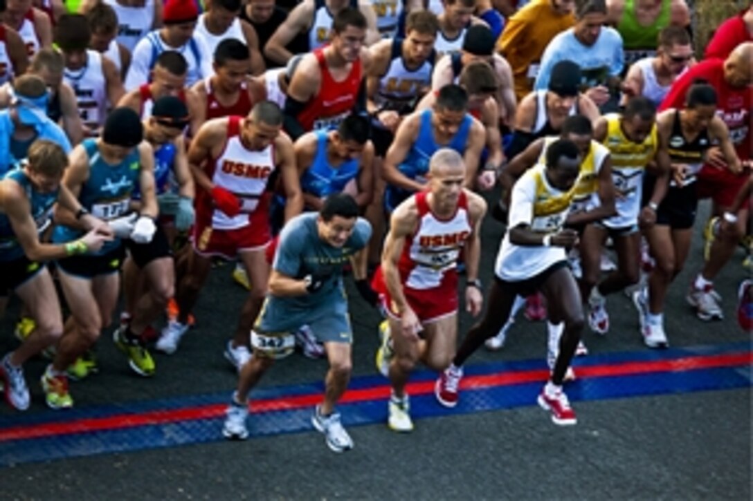 Participants in the 35th annual Marine Corps Marathon begin their 26.2-mile journey in Washington, D.C., Oct. 31, 2010. Tens of thousands of runners raced the clock with a goal of crossing the 14th Street Bridge within six hours.