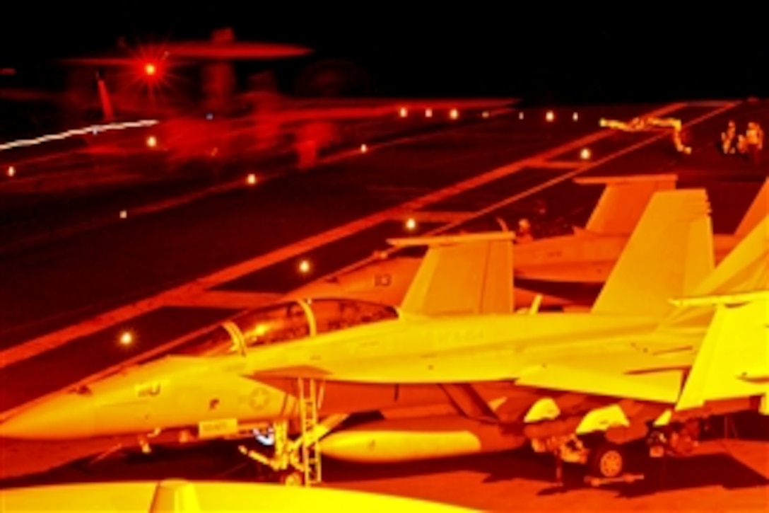 An E-2C Hawkeye launches from the flight deck aboard the aircraft carrier USS Ronald Reagan in the Pacific Ocean, Oct. 30, 2010. The aircraft is assigned to the Black Eagles of Airborne Early Warning Squadron 113, which is conducting carrier qualifications to prepare for an upcoming deployment.