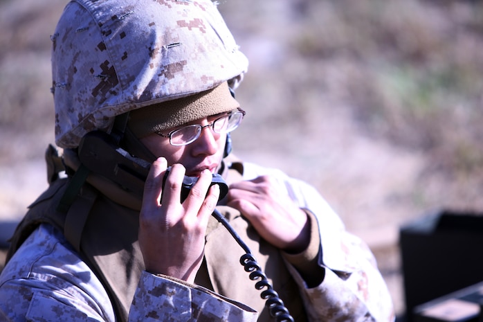 Cpl. Kevin Xiong, a supply administration specialist with 2nd Medical Battalion, Combat Logistics Regiment 25, 2nd Marine Logistics Group, calls the combat operation command during a field exercise aboard Camp Lejeune, N.C., Nov. 2, 2010. The battalion participated in the five-day training evolution from Oct. 30 to Nov. 4 at the base’s Military Operations on Urban Terrain training facility, known as MOUT Town, in preparation for their upcoming deployment to Afghanistan. (U.S. Marine Corps photo by Pfc. Franklin E. Mercado)