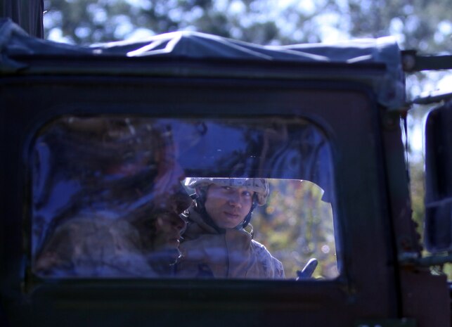 Lance Cpl. Diego Monsalve, a supply administration specialist with 2nd Medical Battalion, Combat Logistics Regiment 25, 2nd Marine Logistics Group, verifies a vehicle as it enters a entrance control point during a field exercise aboard Camp Lejeune, N.C., Nov. 2, 2010. The battalion participated in the five-day training evolution from Oct. 30 to Nov. 4 at the base’s Military Operations on Urban Terrain training facility, known as MOUT Town, in preparation for their upcoming deployment to Afghanistan. (U.S. Marine Corps photo by Pfc. Franklin E. Mercado)