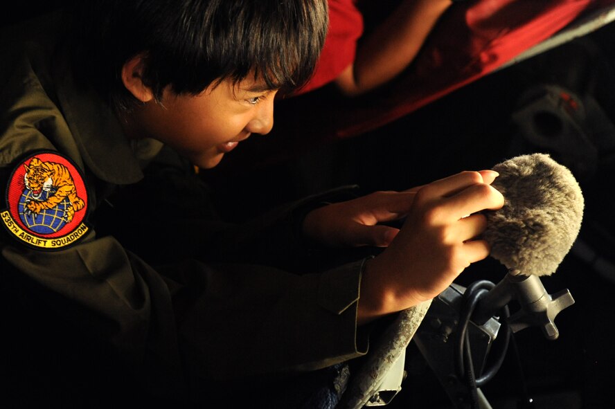 11-year-old Ryder Lum checks out the boom of a Hawaii Air National Guard KC-135 Stratotanker during his tour of Joint Base Pearl Harbor-Hickam Oct. 29, 2010. Ryder was part of the 535th Airlift Squadron’s quarterly Pilot for a Day program, which allows children with catastrophic disorders or illnesses to experience a day in the life of an Air Force pilot. Ryder was diagnosed with a cancerous brain tumor four years ago and has been in remission for almost two years. (U.S. Air Force photo/Staff Sgt. Carolyn Viss)