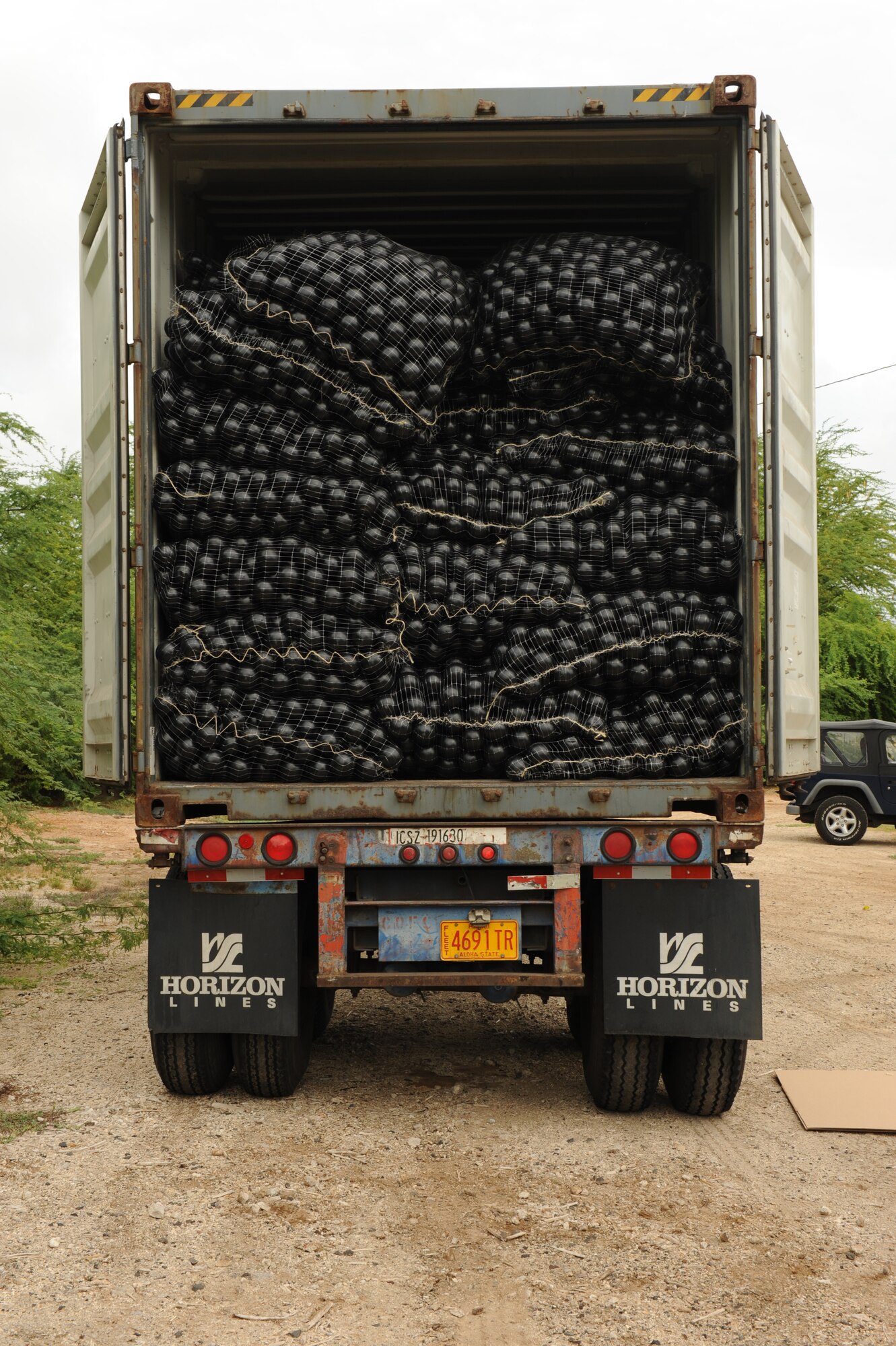 JOINT BASE PEARL HARBOR-HICKAM, Hawaii - More than 70,000 "Armor Balls" lay in the back of a semi truck here, Oct. 26. The Bird Hazard Working Group initiated the bird hazard abatement as part of the Bird/Wildlife Aircraft Strike Hazard, also know as the BASH program, when members of 647th Services Squadron, 647th Contracting Squadron, 15th Wing safety office and Mamala Bay Golf Course workers released “Armor Balls” into the reservoir. (U.S. Air Force photo/Senior Airman Gustavo Gonzalez)
 