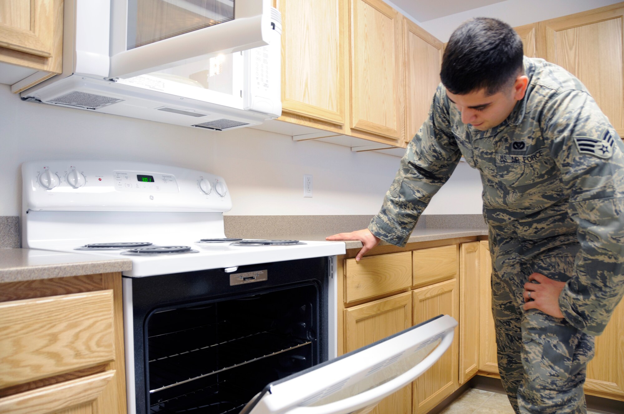 Senior Airman Jason Ahumada inspects newly installed energy star certified appliances Nov. 1, 2010, at Eielson Air Force Base, Alaska.  Accredited energy star products improve energy performance and are a way to help meet or exceed national energy efficiency goals.  Airman Ahumada is assigned to the 354th Civil Engineering Squadron as a contruction inspector.  U.S. Air Force photo/Airman 1st Class Yash Rojas
