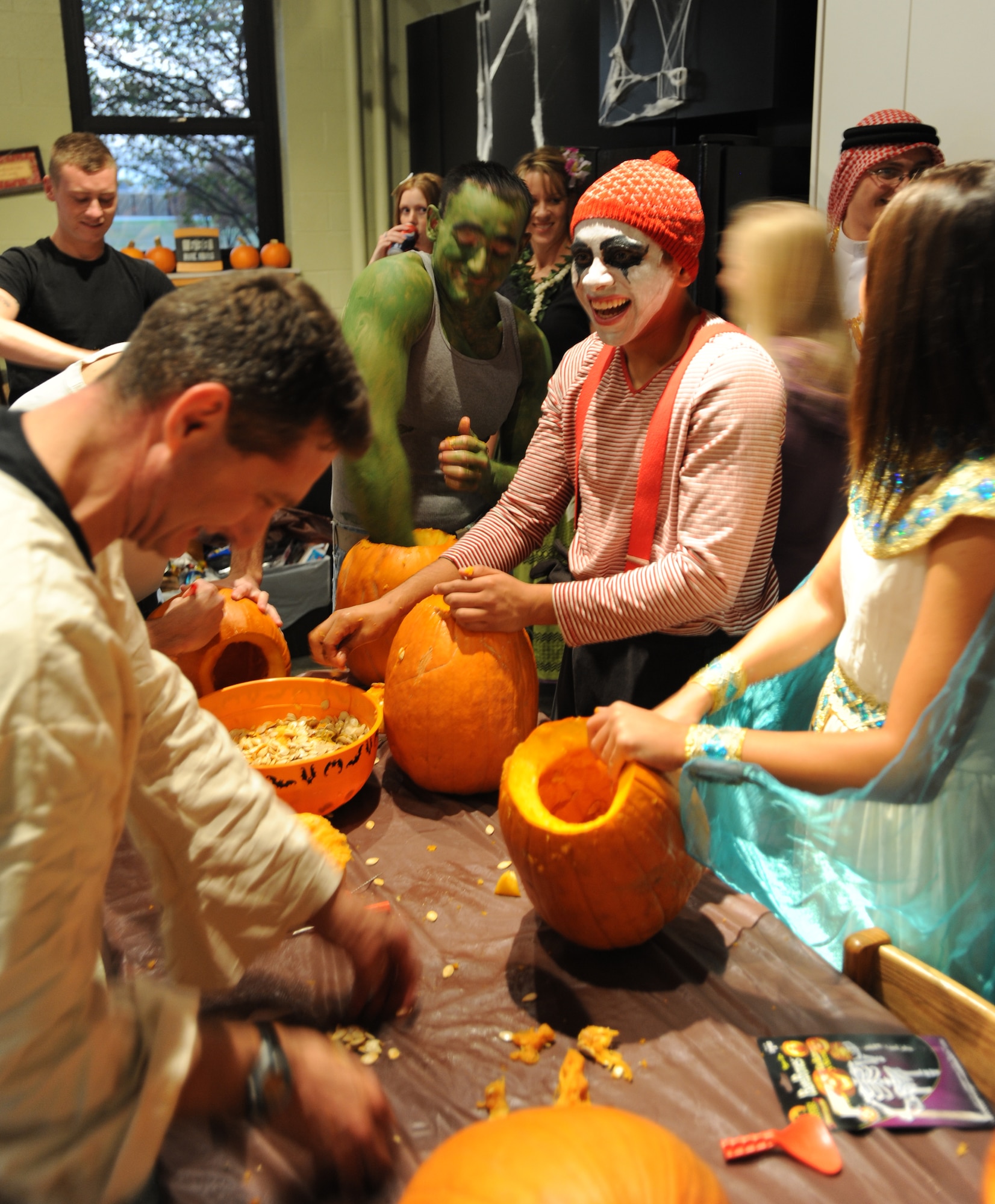 Airmen from McConnell carve pumpkins during the Den’s Halloween Dorm Party Oct. 30, 2010, McConnell Air Force Base, Kan. The Den hosted the event to promote a safe and fun environment for Airmen who are dorm residents.  The Den is a chapel-sponsored program.  (U.S. Air Force photo/Airman 1st Class Armando A. Schwier-Morales)