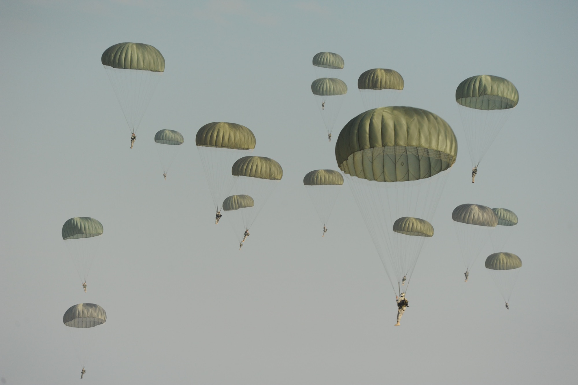 Paratroopers from the 507th Airborne School fall from the sky over Ft. Benning, Ga. after jumping out of a C-17 Globemaster from the 535th Airlift Squadron at Joint Base Pearl Harbor Hickam, Hi. Oct. 14. A C-17 from the 15th Wing made the long journey from Hawaii to Ft. Benning to support the student jump requirements of the 507th AS. (U.S. Air Force photo/Staff Sgt. Nathan Allen) 
