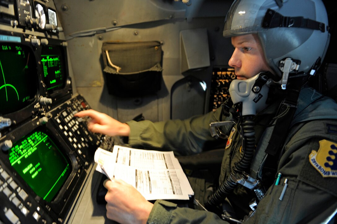 ELLSWORTH AIR FORCE BASE, S.D. - Capt. Patrick Helton, 37th Bomb Squadron weapon systems officer, prepares for a flight aboard a B-1B Lancer, Oct. 27.  The B-1 can rapidly deliver massive quantities of precision and non-precision weapons against any adversary, anywhere in the world, at any time. (U.S. Air Force photo/Staff Sgt. Marc I. Lane)