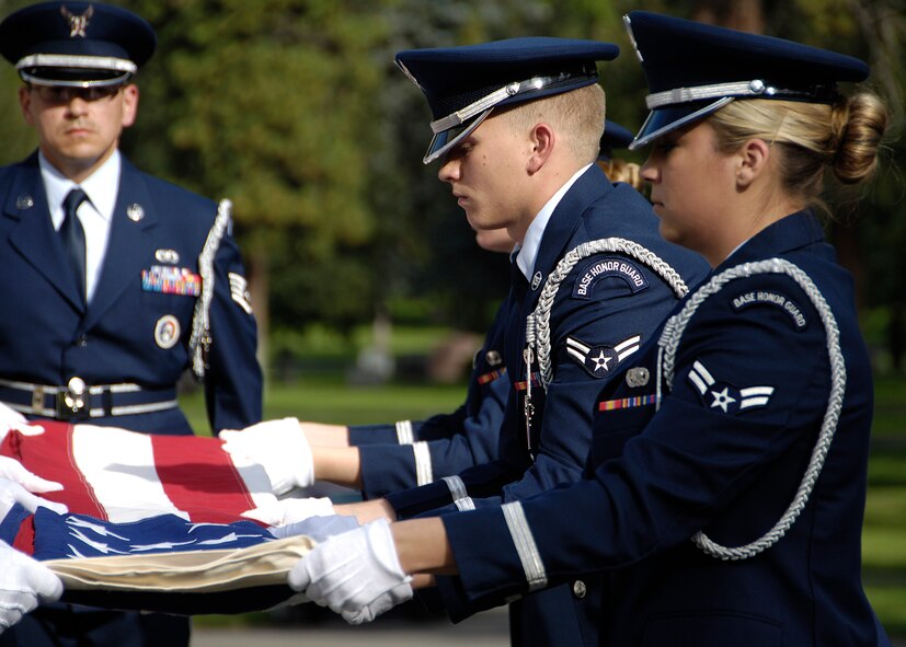 The Fairchild Air Force Base Honor Guard folds the flag during Staff Sgt. Clifford Mast’s memorial service Sept. 18, 2010 at Riverside Memorial Park. Sergeant Mast went MIA after the aircraft he was on was shot down by enemy fire.  
 (U.S. Air Force photos/Airman 1st Class Natasha E. Stannard)