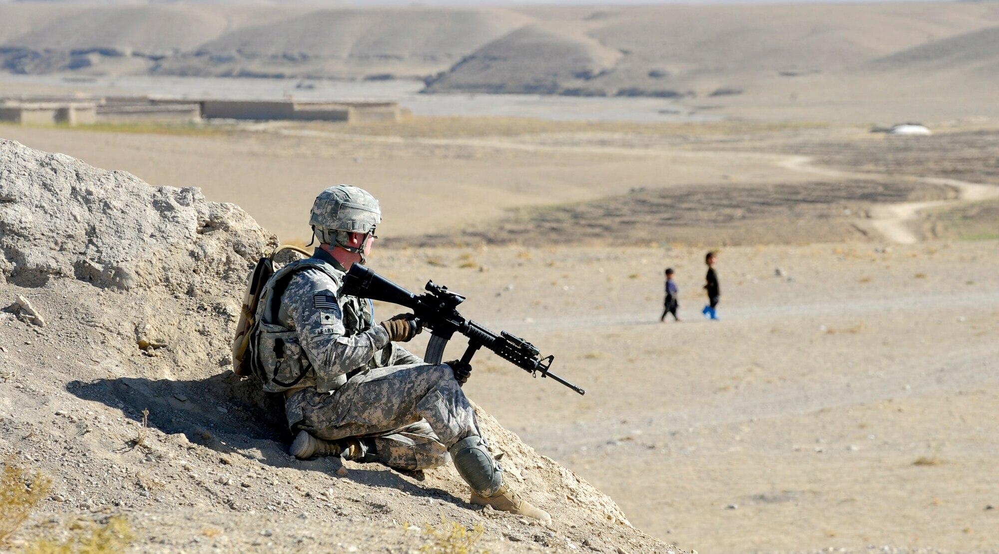 U.S. Army Specialist Timothy Leary pulls security during a patrol from a hill Nov. 1, 2010, near the city of Qalat, Afghanistan, in the Zabul Province. The Provincial Reconstruction Team Zabul is composed of Air Force, Army, Department of State, U.S. Agency for International Development and Department of Agriculture personnel who work with the government of Afghanistan to improve governance, stability and development throughout the province. (U.S. Air Force photo/Staff Sgt. Brian Ferguson)