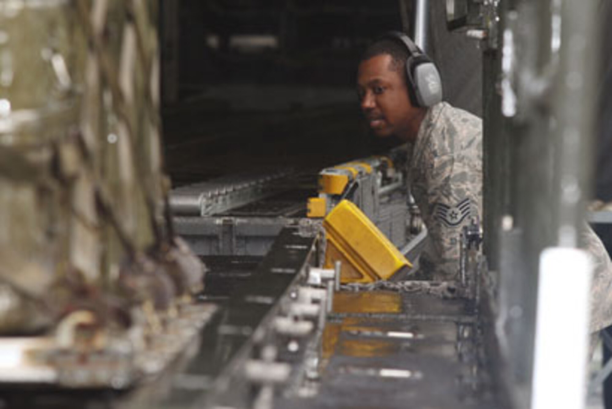 Competitors line up the k-loader for cargo off-load during the completion of the 25K course at the Port Dawg Challenge 2010. (U.S. Air Force Photo/Don Peek)