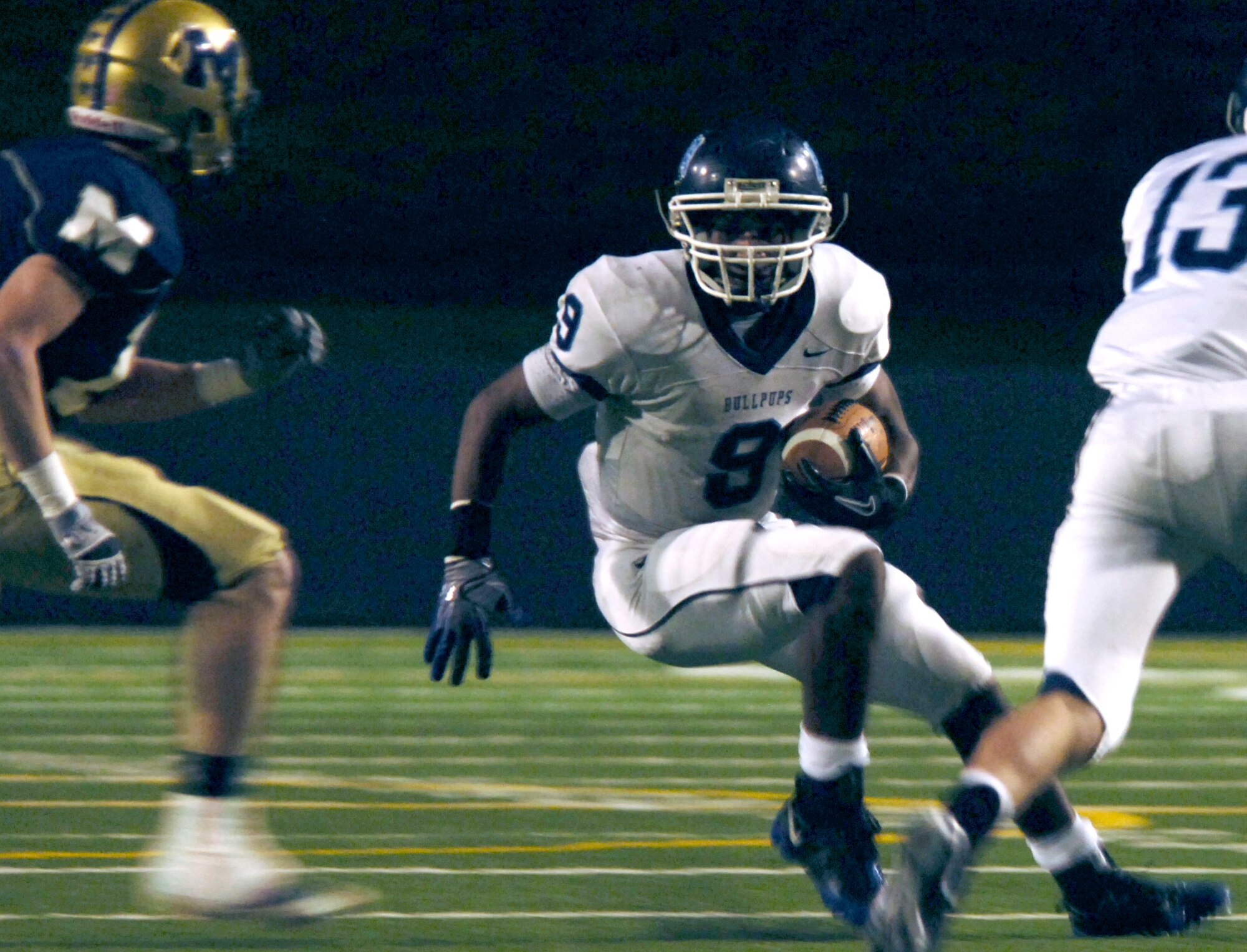 Bishop Sankey, number 9, jukes the opposing team as he heads for the end-zone Oct. 21, 2010 at Joe Albi Stadium during a Gonzaga Prep and Mead football game. Sankey is the running-back for the Gonzaga Prep Bull-pups and son of Fairchild Airman Tech. Sgt. Christopher Sankey. This year, Sankey broke the single season rushing record and made the top of the Greater Spokane League’s all rushing list with 4,141 yards. (U.S. Air Force photo/ Airman 1st Class Natasha E. Stannard)