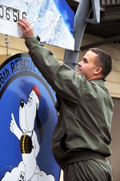 Tech. Sgt. Joseph Brownell changes the number of people saved from 650 to 656 Oct. 29, 2010, at Fairchild Air Force Base, Wash. Sergeant Brownell was one of five crew members who rescued a father and daughter who'd been missing in Northern Idaho and  then, on a separate mission during the same day, four campers and their dog. Sergeant Brownell is a medic with the 36th Rescue Flight.  (U.S. Air Force photo/Airman 1st Class Mary Norenberg)