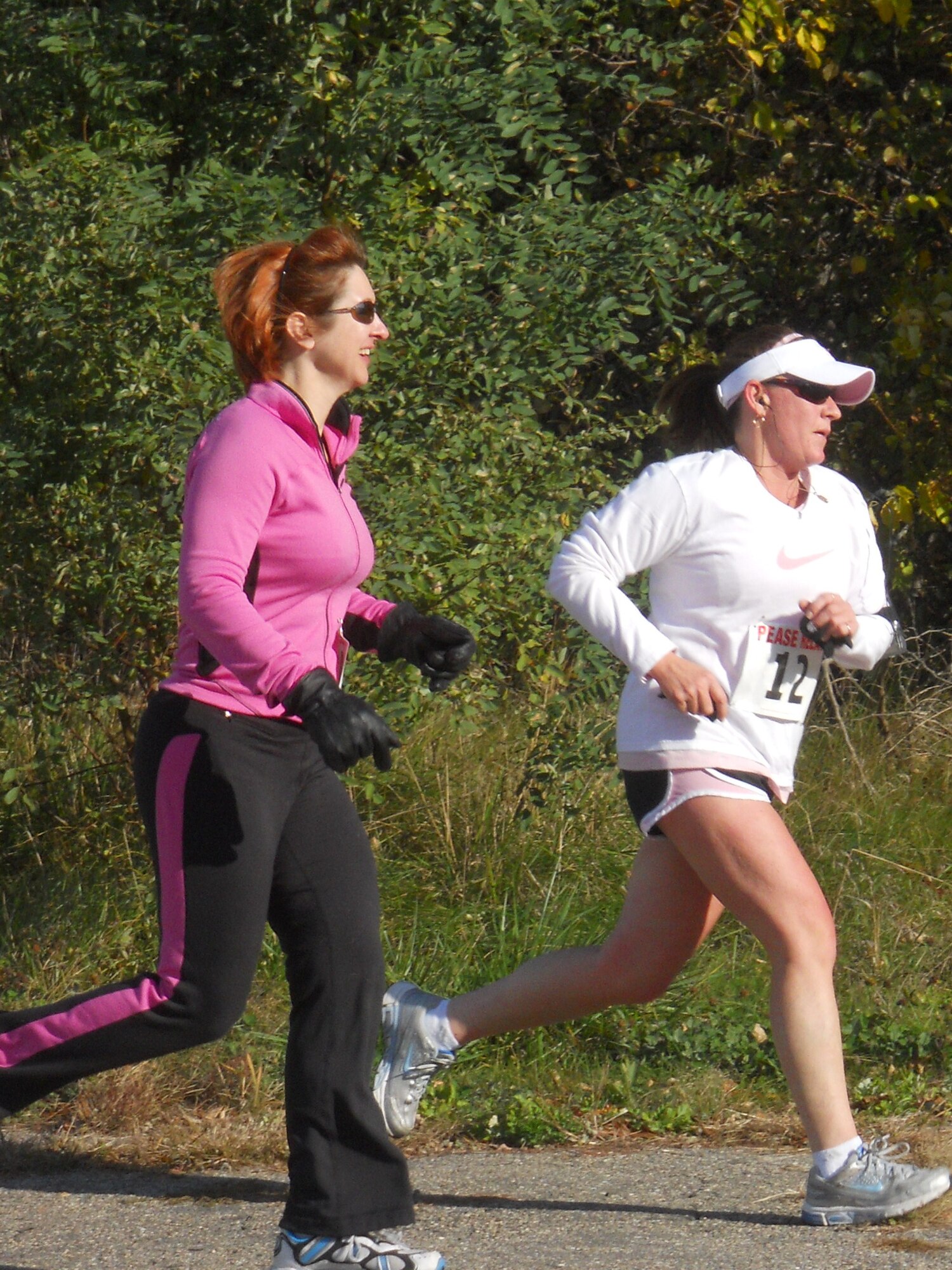 Capt. Darci Rubin (left) and Maj. Alyn Theriault of the 157th Medical Group take part in the 2nd Annual Pease Relay Race Oct. 17. (Photo: Chief Master Sgt. VInce Sherman) 

