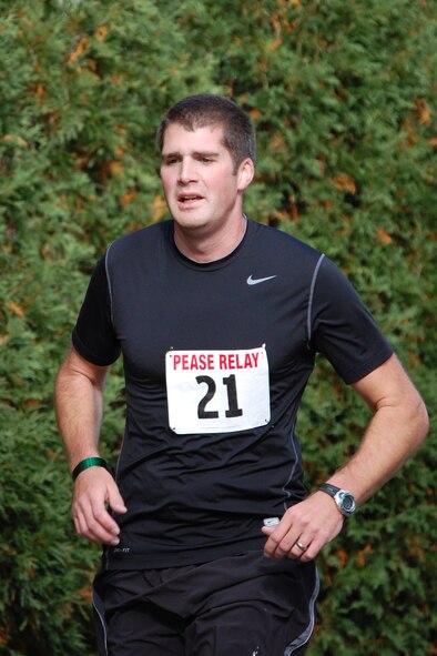 Staff Sgt. Justin Webb of the 157th Maintenance Group runs the second leg of the 2nd Annual Pease Relay Race Oct. 17.  (Photo: Chief Master Sgt. VInce Sherman) 
