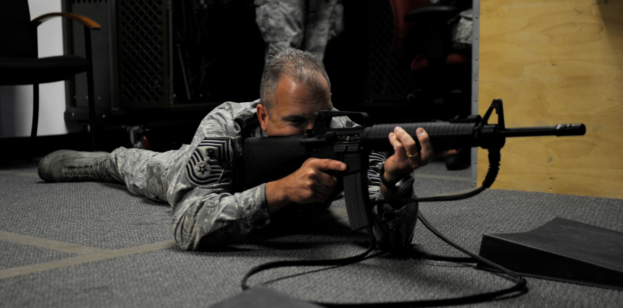 MOUNTAIN HOME AIR FORCE BASE, Idaho -- Chief Master Sgt. Martin Klukas, Air Combat Command command chief, uses the Security Forces simulator, where he engaged in various weapons training Oct. 28. Chief Klukas recently spent three days touring the base to learn about the Gunfighters mission. (U.S. Air Force photo by Senior Airman Renishia Richardson) 
