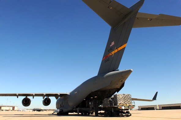 Airmen with the 509th Logistics Readiness Squadron, load humanitarian aid cargo onto a C-17, Oct 17, 2010 to be shipped to people in need in Honduras. (U.S. Air Force photo by Senior Airman Kenny Holston)(Released)