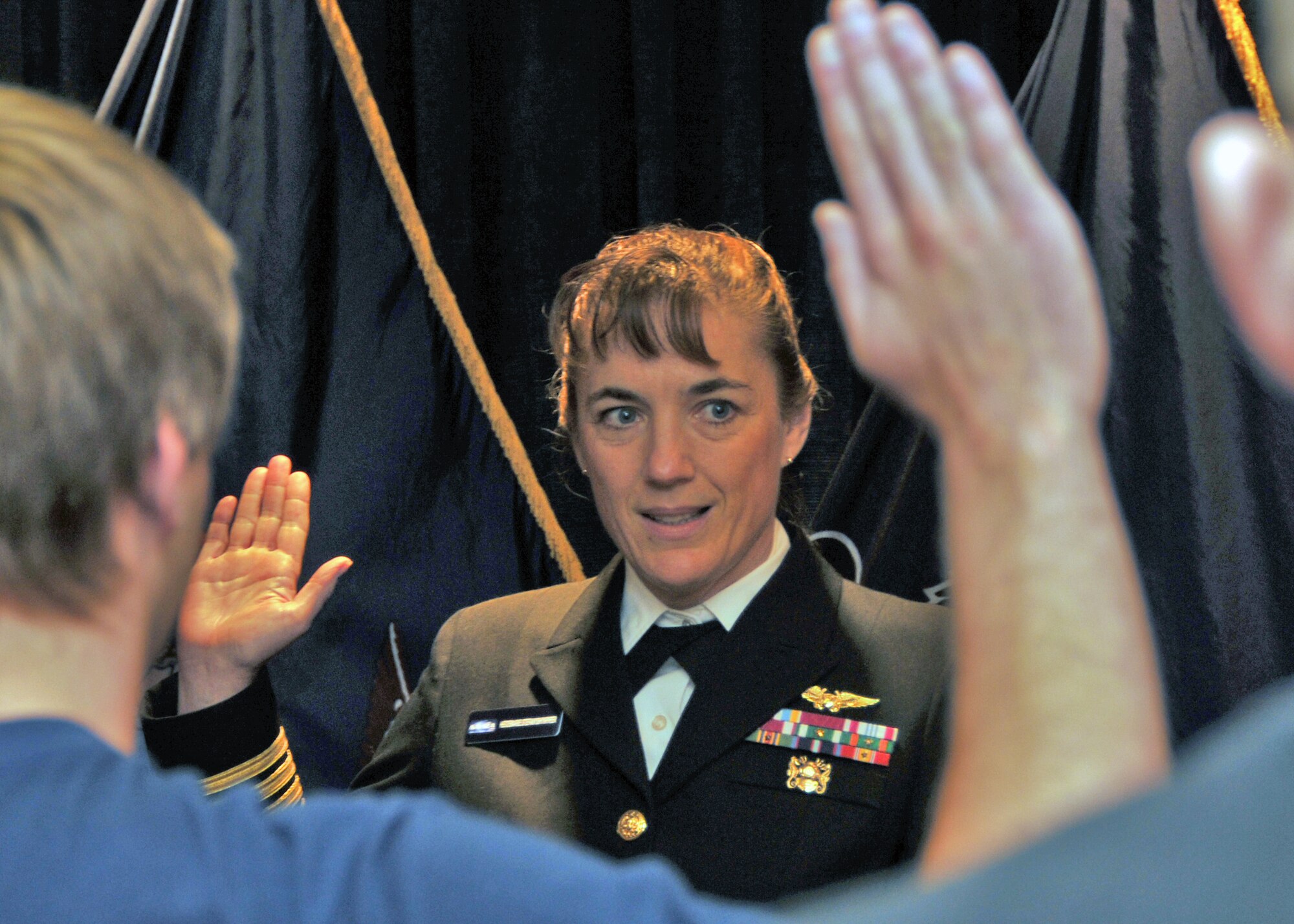 Former U.S. Astronaut U.S. Navy 1st Capt. Heidemarie M. Stefanyshyn-Piper administers the Oath of Enlistment at the Military Entrance Processing Station November 1, 2010, Niagara Falls NY. Among those being sworn in is her son Michael Piper who will shipping to Navy Boot Camp.  (U.S. Air Force photo by Staff Sgt. Joseph McKee)