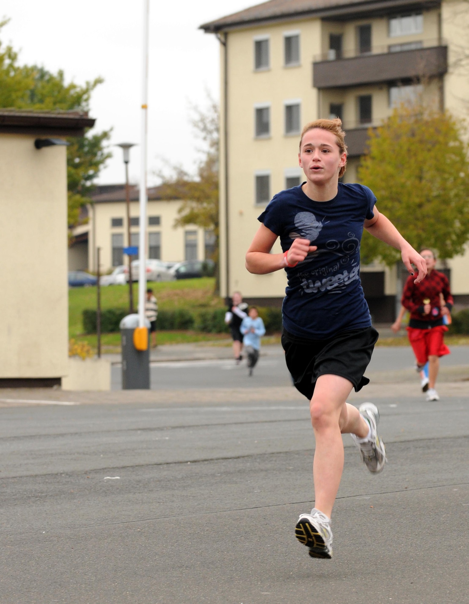 SPANGDAHLEM AIR BASE, Germany – Joslynn Hernandez, Bitburg Middle School student, races to the finish line of the one-mile fun run at the Bitburg Middle School Oct. 28. The Red Ribbon Week fun run helped raise awareness about the dangers of drug and alcohol abuse. (U.S. Air Force photo/Airman 1st Class Matthew B. Fredericks)
