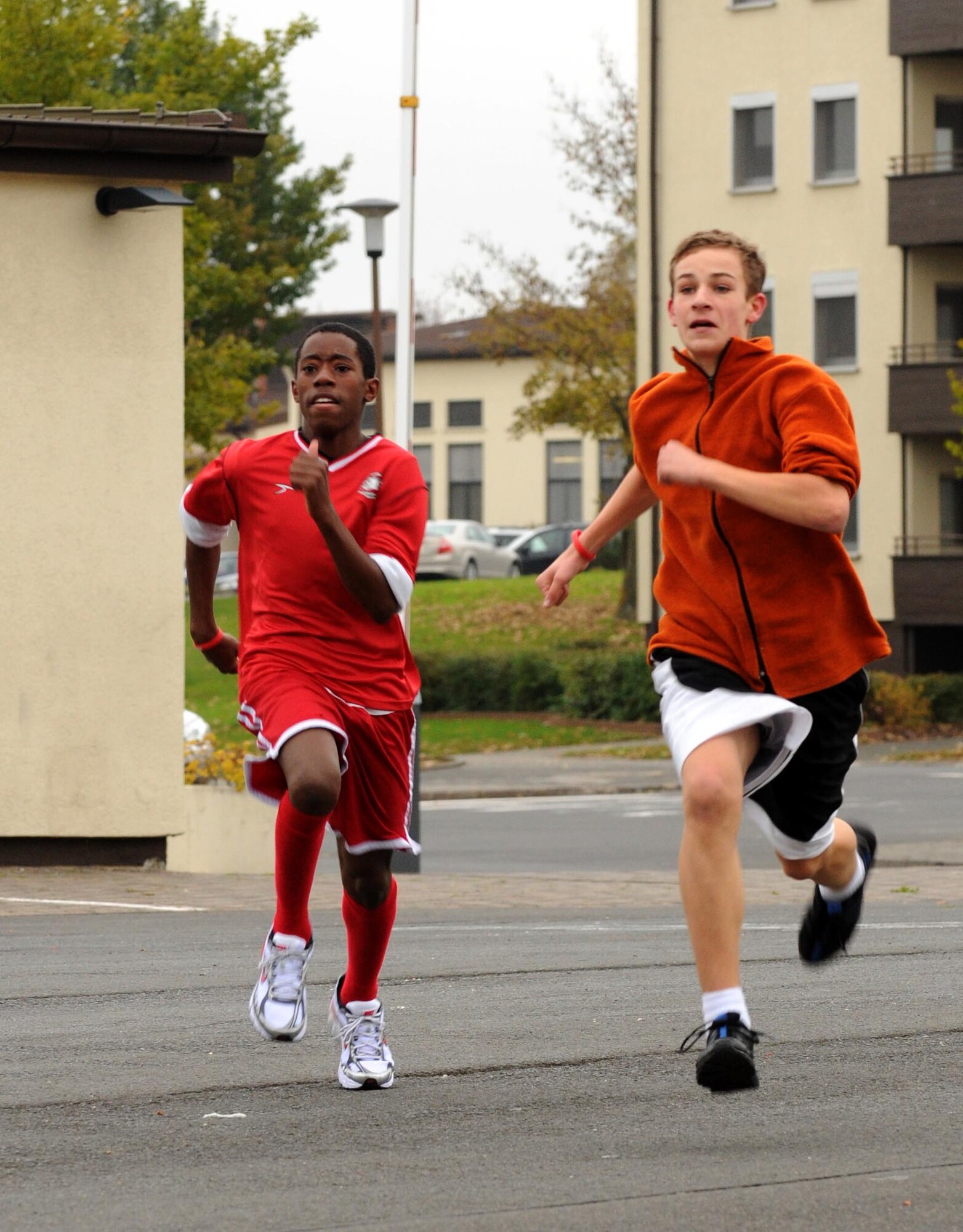 SPANGDAHLEM AIR BASE, Germany – Bryon Hancock, Bitburg Middle School student, right, fights to stay ahead of classmate Brian Sims during a one-mile fun run at the Bitburg Middle School Oct. 28. The Red Ribbon Week fun run helped raise awareness about the dangers of drug and alcohol abuse. (U.S. Air Force photo/Airman 1st Class Matthew B. Fredericks)