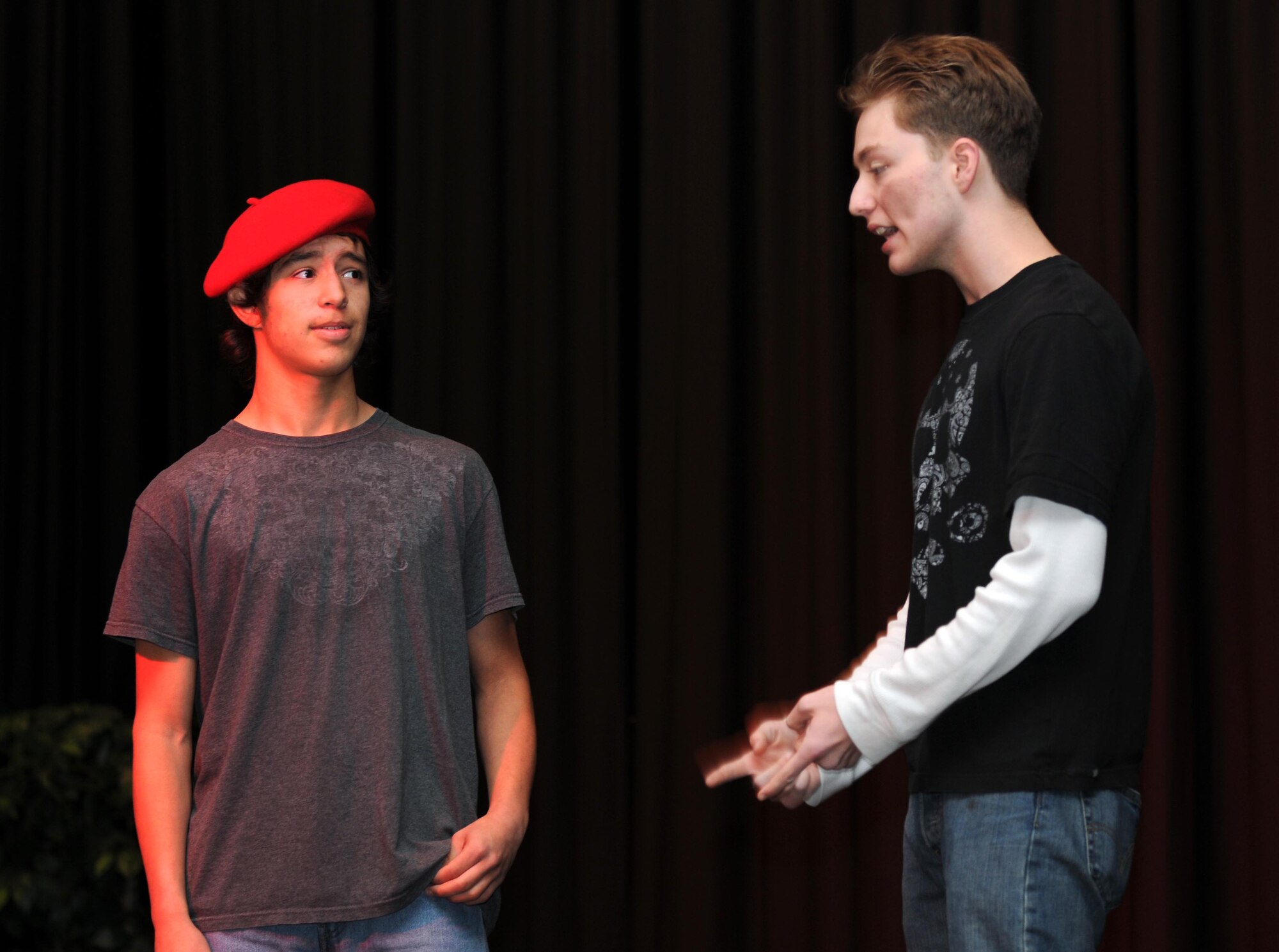 SPANGDAHLEM AIR BASE, Germany – Devin Lantagne, left, and Andrew Glynn, both Bitburg High School drama club members, act out a skit for their fellow students during a Red Ribbon Week assembly at their school Oct. 26. The school’s drama club put on several skits during the assembly to raise awareness about drug and alcohol abuse. (U.S. Air Force photo/Airman 1st Class Matthew B. Fredericks)