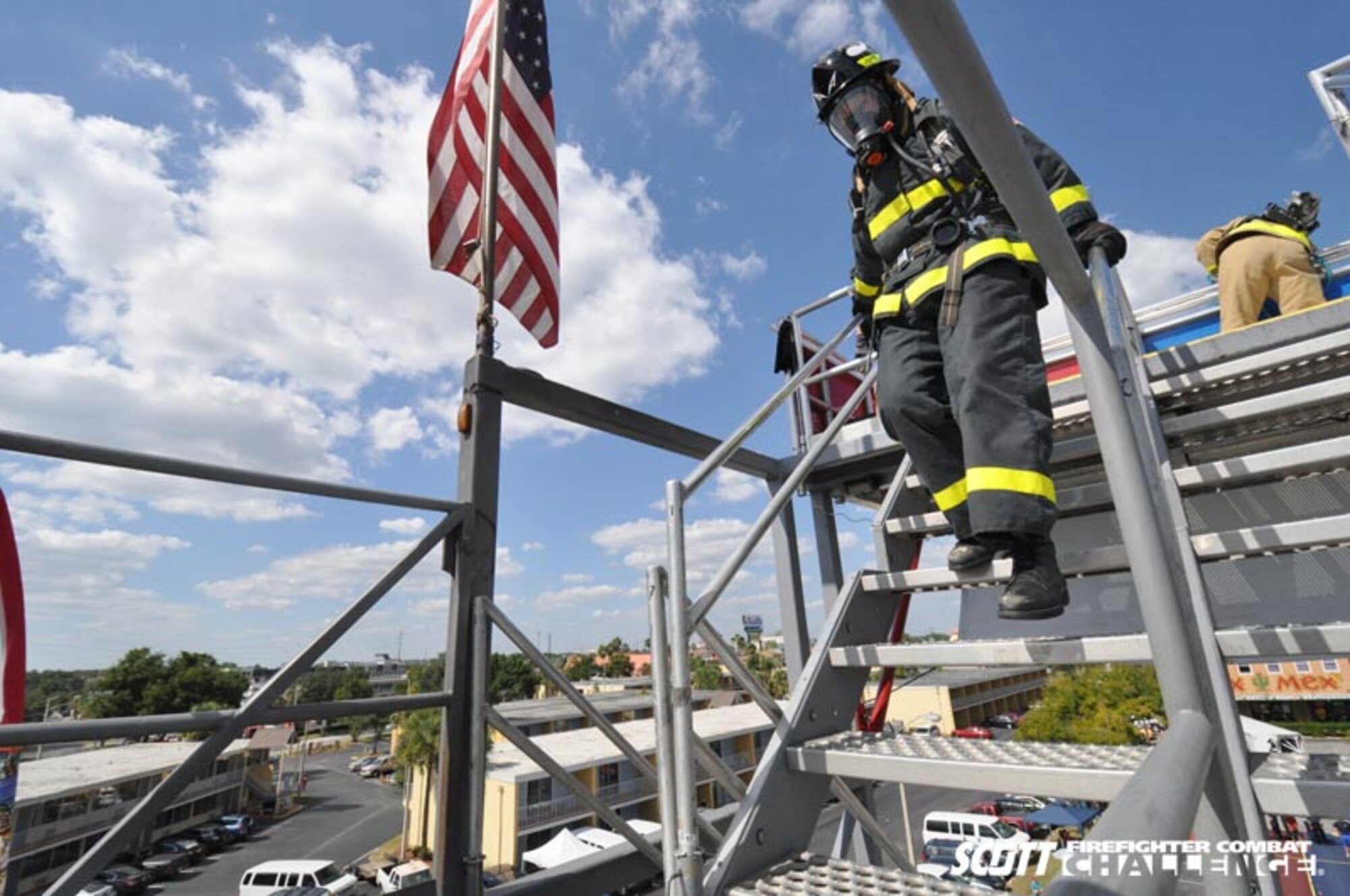 KISSIMMEE, Fla. -- Tech. Sgt. Jessica Packard, SAMS Squad team member, climbs down a five-story tower during the National Scott Firefighter Combat Challenge Oct. 22-24. Sergeant Parckard took first place in the female category finishing in 2:28.24. (Courtesy photo/Firefighter Combat Challenge)