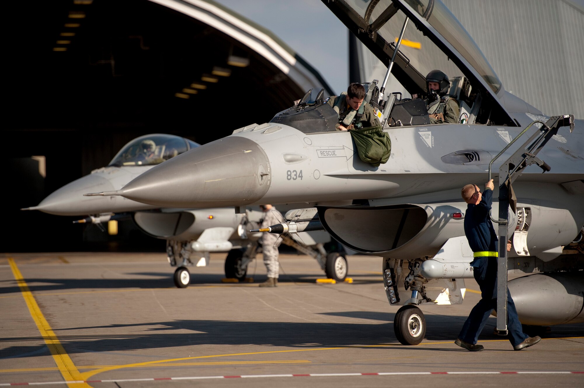 U.S. Air Force Capt. Chris Nations, 14th Fighter Squadron standardization and evaluations officer, and Staff Sgt. Bernard Mutz, 35th Civil Engineer Squadron readiness and emergency manager, prepare for takeoff in an F-16 Fighting Falcon at Misawa Air Base, Japan, Oct. 22, 2010. Among Sergeant Mutz's accomplishments earning him the title of 35th Mission Support Group Airman of the Year, he co-managed the base emergency management program, training more than 250 emergency managers and representatives. The 35th Fighter Wing gives incentive flights to outstanding Airmen each year to reward their exceptional work and dedication. (U.S. Air Force photo by Staff Sgt. Samuel Morse/Released)