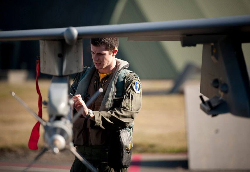 U.S. Air Force Capt. Chris Nations, 14th Fighter Squadron standardization and evaluations officer, performs preflight checks on an F-16 Fighting Falcon at Misawa Air Base, Japan, Oct. 22, 2010. Captain Nations said he rarely sees fliers who aren't smiling ear-to-ear after their incentive ride. He enjoys being able to show Airmen what their exceptional work supports and how they contribute to the success of the wing's mission. The 35th Fighter Wing gives incentive flights to outstanding Airmen each year to reward their exceptional work and dedication. (U.S. Air Force photo by Staff Sgt. Samuel Morse/Released)