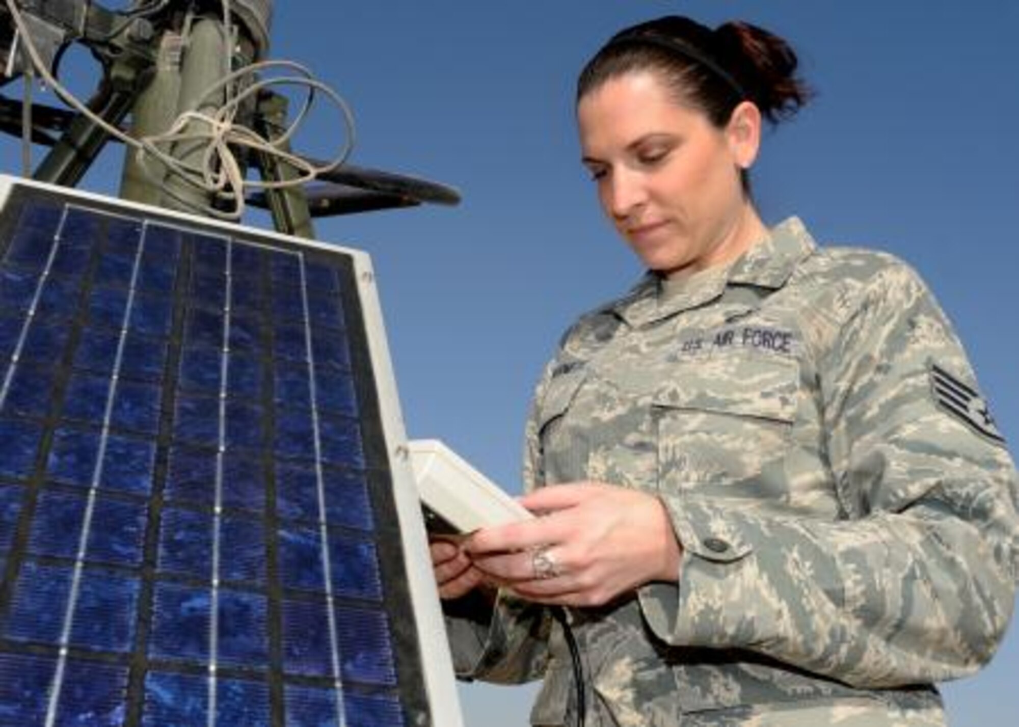 SOUTHWEST ASIA -- Staff Sgt. Ashley Barnett, a weather forecaster for the 386th Air Expeditionary Wing, collects data from a TMQ-53 weather sensor to observe conditions and update forecasts at an undisclosed air base in Southwest Asia, Oct. 28, 2010. The 386th AEW forecasters work behind the scenes to provide Air Force and Army personnel with accurate, up-to-date forecasts so flying missions can continue in support of operations Enduring Freedom and New Dawn. Barnett is deployed from Air Mobility Command’s 305th Operations Support Squadron, 305th Air Mobility Wing, at Joint Base McGuire-Dix-Lakehurst, N.J. (U.S. Air Force Photo by Senior Airman Laura Turner)