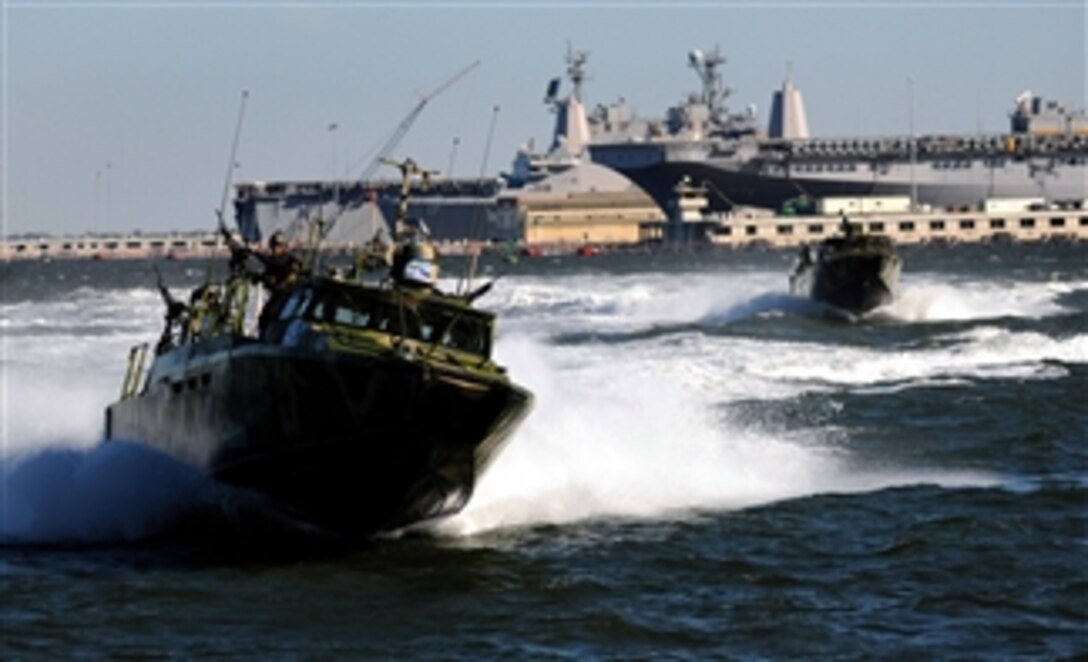 U.S. Navy sailors with Riverine Group 1 conduct maneuvers aboard a Riverine Command Boat (Experimental) (RCB-X) during an alternative fuels demonstration at Naval Station Norfolk, Va., on Oct. 22, 2010.  The RCB-X boat was powered by an alternative fuel blend of 50 percent algae-based and 50 percent fuel oil to support the Secretary of the Navy's efforts to reduce total energy consumption on naval ships.  