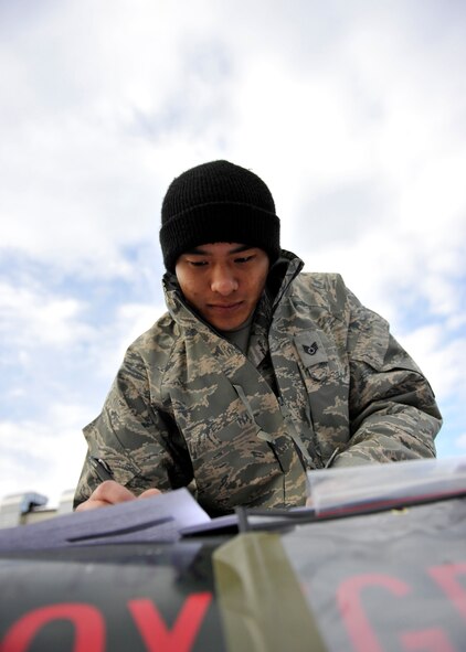 U.S. Air Force Staff Sgt. Vang Le, 35th Maintenance Squadron aerospace ground equipment specialist, inspects a liquid oxygen tank during an operational readiness exercise, Nov. 4, 2010, at Misawa Air Base, Japan. Liquid oxygen is used so pilots can breathe at high altitudes. (U.S. Air Force photo by Staff Sgt. Chad C. Strohmeyer/Released)
