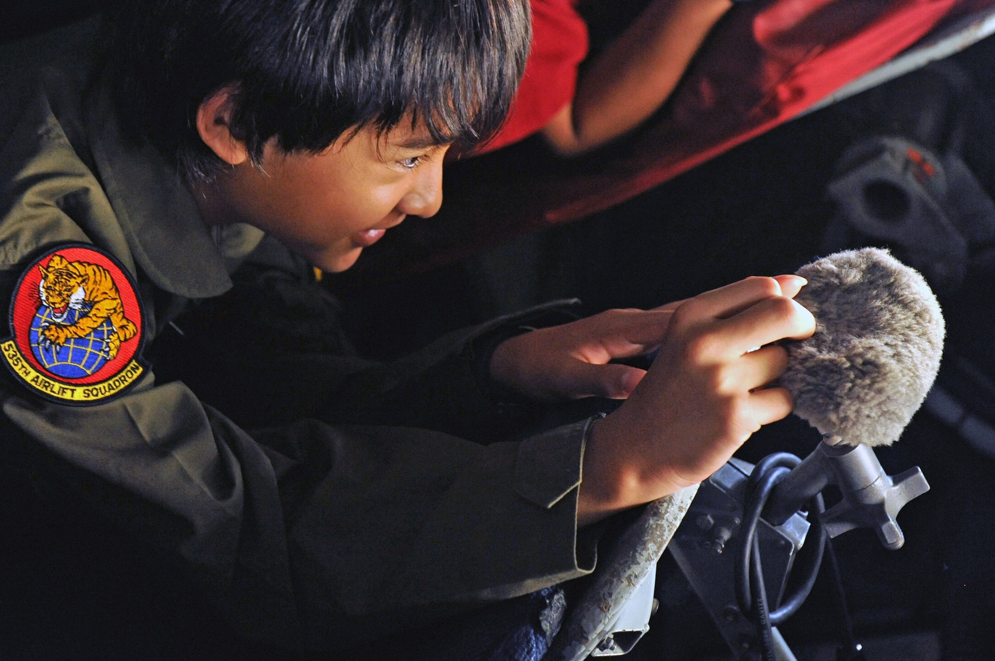 11-year-old Ryder Lum checks out the boom of a KC-135 Stratotanker Oct. 29, 2010, during his tour of Joint Base Pearl Harbor-Hickam, Hawaii. Ryder was part of the 535th Airlift Squadron's quarterly Pilot for a Day program, which allows children with catastrophic disorders or illnesses to experience a day in the life of an Air Force pilot. (U.S. Air Force photo/Staff Sgt. Carolyn Viss)