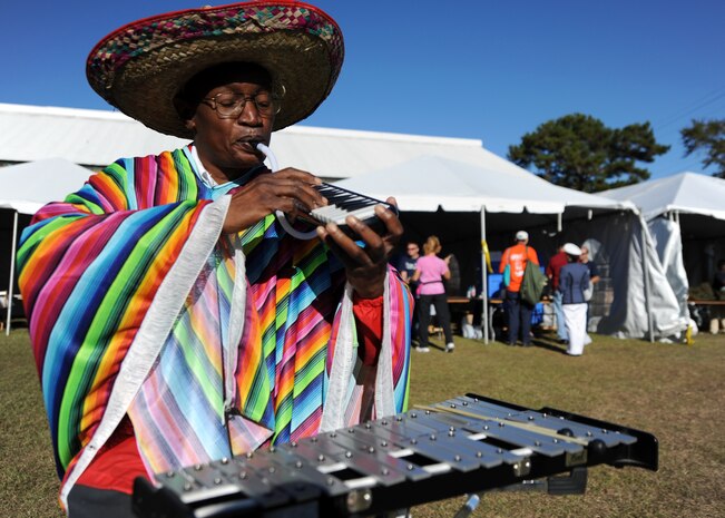 Clarence McDonald performs live gospel music as a member of the "Veterans in Arms" choir to relax and entertain visitors at the 11th annual Stand Down Against Homelessness Oct. 29, 2010, at the North Charleston Armory Park, S.C. The Veterans in Arms choir is a new organization that plays blues, gospel, and other relaxing genres at veteran community events. (U.S. Air Force photo/Senior Airman Timothy Taylor)