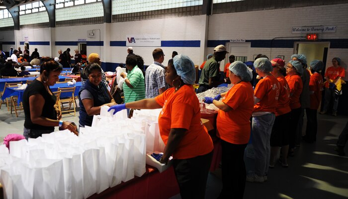 Volunteers prepare fresh breakfast bags and coffee for visitors at the 11th annual Stand Down Against Homelessness Oct. 29, 2010, at the North Charleston Armory Park, S.C. More than 300 volunteers from the local community and members of the local military helped to show their support. (U.S. Air Force photo/Senior Airman Timothy Taylor)