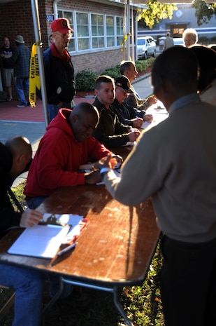 Volunteers process veterans and civilians before entering the 'Stand Down' facility for dental and medical checkups, at the 11th annual Stand Down Against Homelessness Oct. 29, 2010, at the North Charleston Armory Park, S.C. Sponsored by the Ralph H. Johnson Veterans Affairs Medical Center and Goodwill Industries, the event provided food, clothing vouchers, medical and dental screenings, job and legal assistance, and personal hygiene items to the homeless. (U.S. Air Force photo/Senior Airman Timothy Taylor)