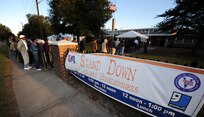 Homeless people, both veterans and civilians line up to begin the check in process to receive aid from local volunteers at the 11th annual Stand Down Against Homelessness Oct. 29, 2010, at the North Charleston Armory Park, S.C. More than 300 volunteers from the local community and members of the local military volunteered their time. (U.S. Air Force photo/Senior Airman Timothy Taylor)



