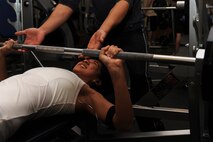 MINOT AIR FORCE BASE, N.D. -- Airman 1st Class Monica Diaz De Lope-Diaz, 5th Operations Support Squadron air crew flight equipment, warms up before starting his weight lifting routine at the McAdoo Sports and Fitness Center here Nov. 3. It is important to ensure an ample amount of strength training is incorporated into time spent at the gym. (U.S. Air Force photo by Airman 1st Class Aaron-Forrest Wainwright)