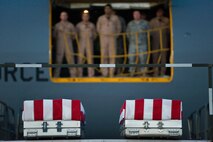 The remains of Army Spc. Jonathan M. Curtis, of Belmont, Mass., and ArmyPfc. Andrew N. Meari, of Plainfield, Ill., await transfer at Dover Air ForceBase, Del., Nov. 2, 2010.  Curtis and Meari were assigned to the 1stBattalion, 502nd Infantry Regiment, 2nd Brigade Combat Team, 101st AirborneDivision (Air Assault), Fort Campbell, Ky. (U.S. Air Force photo/RolandBalik)