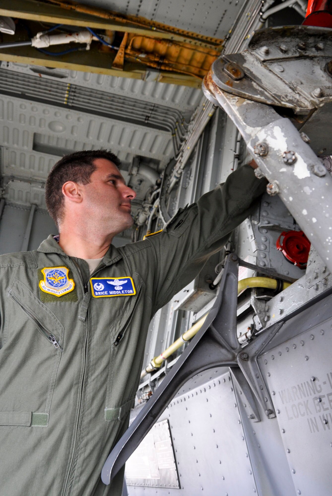 Lt. Col. Brice Middleton, 912th Air Refueling Squadron commander, demonstrates a KC-135 Globemaster III pre-flight check at March Air Reserve Base, Calif. , Oct. 21, 2010. The 912th Air Refueling Squadron stood up Oct. 1, 2010 as an active duty associate unit with the 336th Air Refueling Squadron at March. 