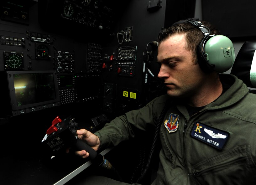 MOODY AIR FORCE BASE, Ga. -- Capt. Daniel Ritter, 71st Rescue Squadron navigator, uses the controls to the forward looking infrared system while flying in the C-130 simulator here Nov. 1. The infrared system allows the crew to see harsh terrain during dense fog and hours of darkness. (U.S. Air Force photo by Airman 1st Class Benjamin Wiseman)(RELEASED)