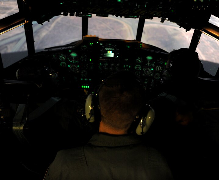 MOODY AIR FORCE BASE, Ga. -- Two pilots and a flight engineer fly inside the C-130 simulator during training here Nov. 1. Pilots, navigator, flight engineers and other crew members trained during the class as if on an actual mission. (U.S. Air Force photo/Airman 1st Class Benjamin Wiseman)(RELEASED)