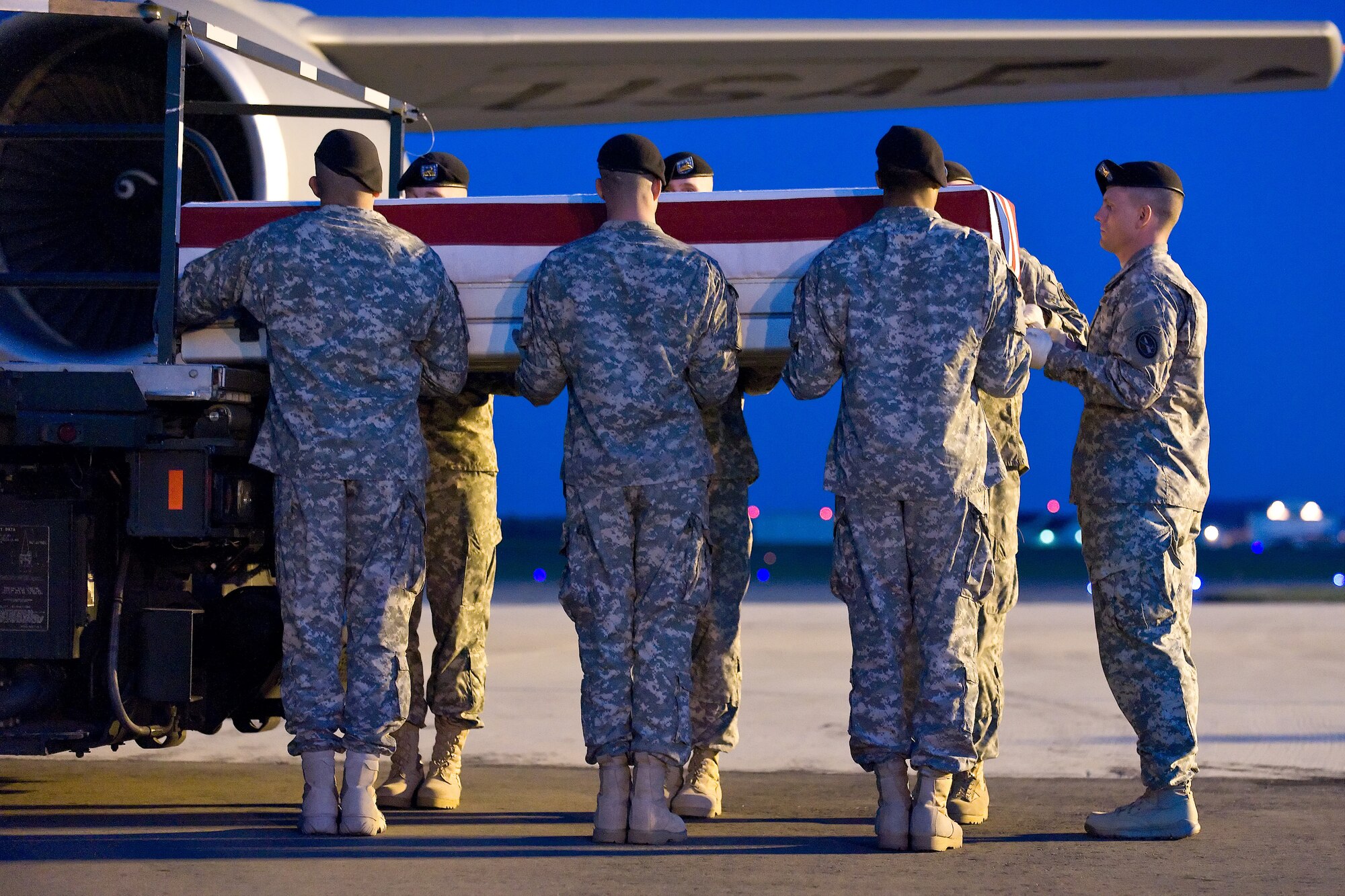 A U.S. Army carry team transfers the remains of Army Pfc. Andrew N. Meari, of Plainfield, Ill., at Dover Air Force Base, Del., Nov. 2, 2010. Meari was assigned to the 1st Battalion, 502nd Infantry Regiment, 2nd Brigade Combat Team, 101st Airborne Division (Air Assault), Fort Campbell, Ky. (U.S. Air Force photo/Roland Balik)
