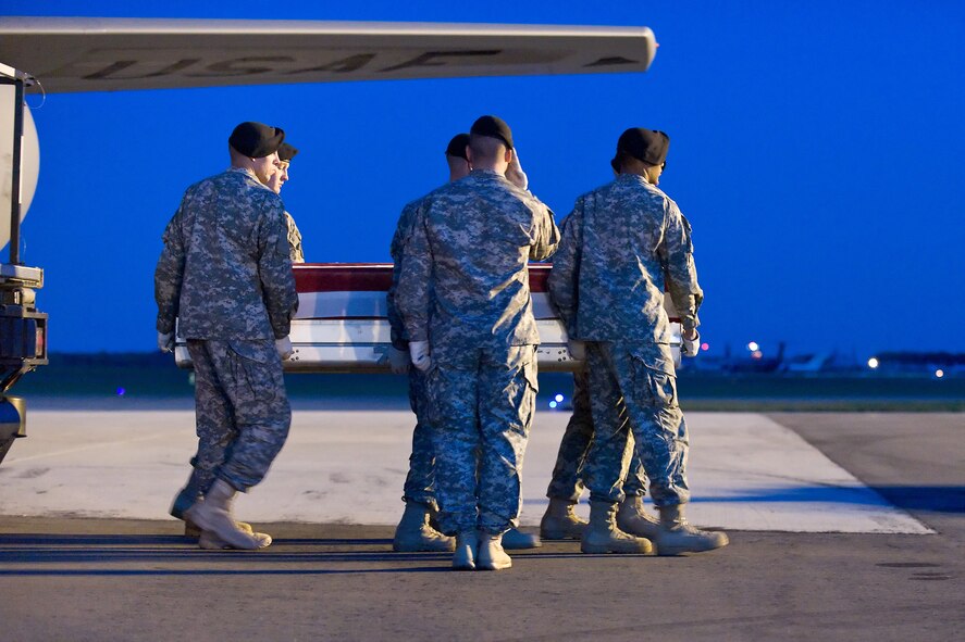 A U.S. Army carry team transfers the remains of Army Spc. Jonathan M. Curtis, of Belmont, Mass., at Dover Air Force Base, Del., Nov. 2, 2010. Curtis was assigned to the 1st Battalion, 502nd Infantry Regiment, 2nd Brigade Combat Team, 101st Airborne Division (Air Assault), Fort Campbell, Ky. (U.S. Air Force photo/Roland Balik)