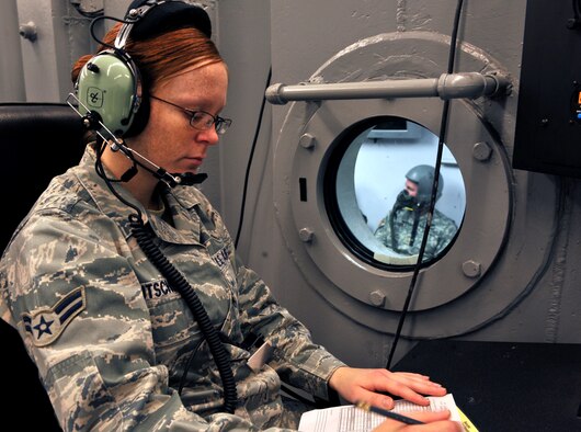SHAW AIR FORCE BASE, S.C. -- Airman 1st Class Jessica Brutschea, 20th Aerospace Medicine Squadron aerospace and operational physiologist, records the times, issues, how the issues were resolved and makes sure each student sits in their assigned seat at the aerospace physiology building Nov. 2, 2010. The high altitude parachute class focuses on human performance at high altitudes and high stress levels. Students take this class before freefall school and as a refresher course every five years. (U.S. Air Force photo/Airman 1st Class Tabatha L. Duarte