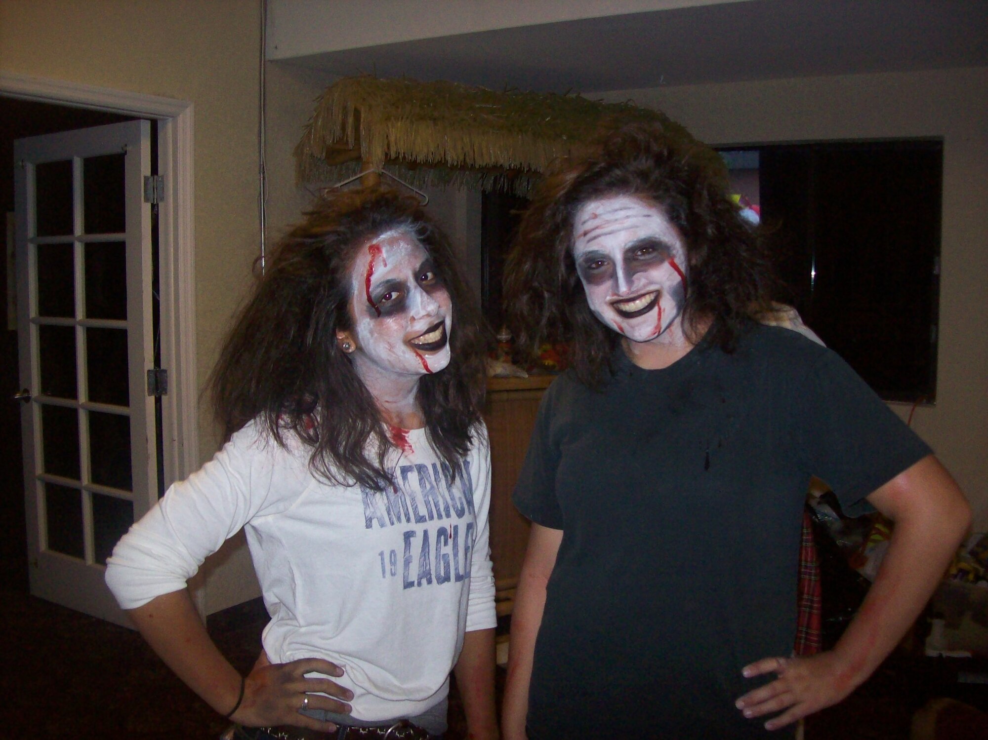 Karina Hamilton and Claudia Castro of SER-FL-279th Civil Air Patrol Squadron show their best zombie smiles. The 279th CAP Squadron from Homestead Air Reserve Base, took part in the third annual Halloween Haunted Festival at Falcon's Nest Club on Sunday, October 31. Cadet members of the unit acted as zombie cast members in both the haunted hayride and haunted house attractions. (photo by Master Sgt. Tim Hamilton)
