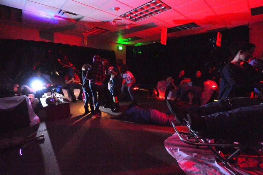 MINOT AIR FORCE BASE, N.D. -- Volunteer monsters and ghouls terrorize adults and children alike in the 5th Force Support Squadron haunted house inside the Minot Outdoor Recreation facility here Oct. 29. Events like these keep Airmen and family morale and spirits high as cold and snow become a mainstay for Team Minot. (U.S. Air Force photo by Master Sgt. Michael Gaddis)