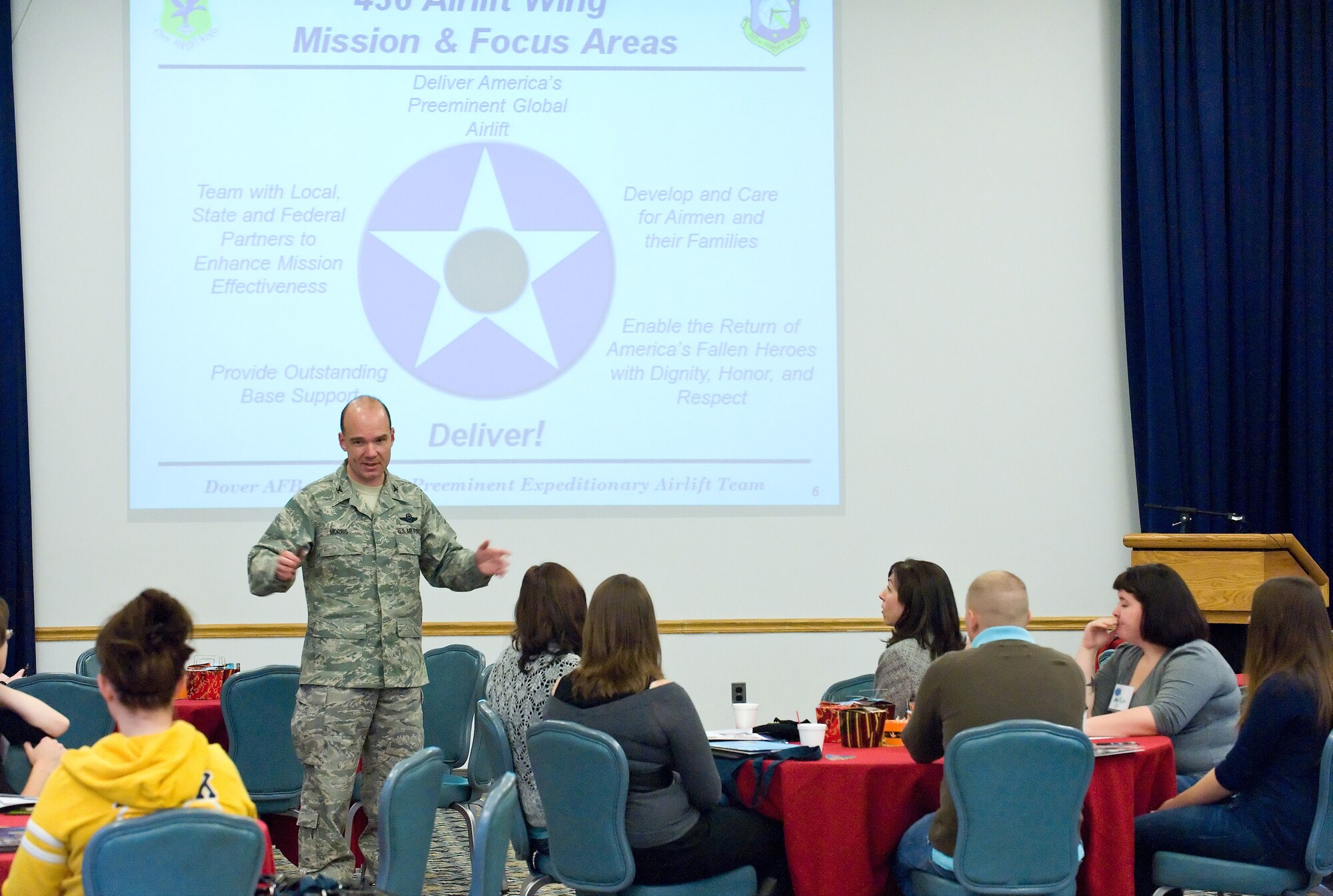 Col. Manson Morris, 436th Airlift Wing commander, speaks to spouses at the Heart Link program meeting Oct. 30, 2010, in The Landings Club. He spoke to the spouses about their importance to the mission and how the Air Force was one giant family. (U.S. Air Force photo by Roland Balik/Released)